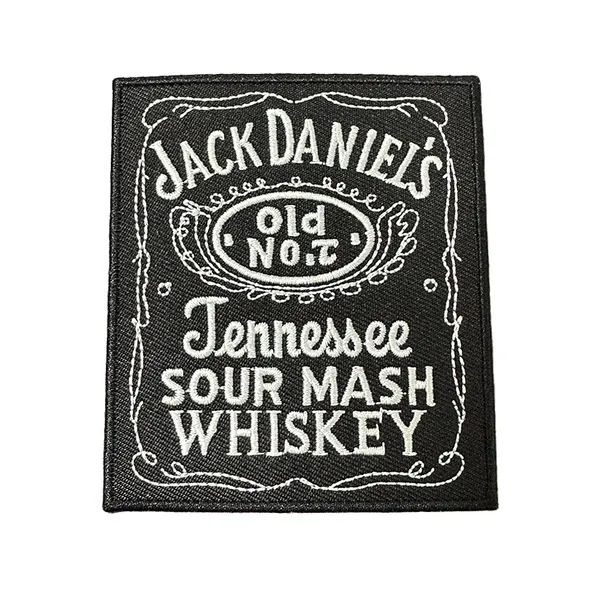 Detailed black-and-white embroidered label