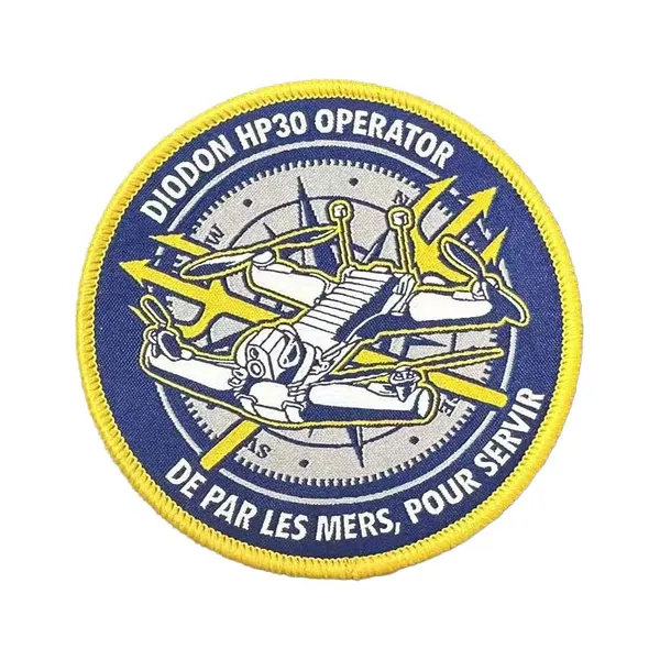 Circular woven emblem with drone detail