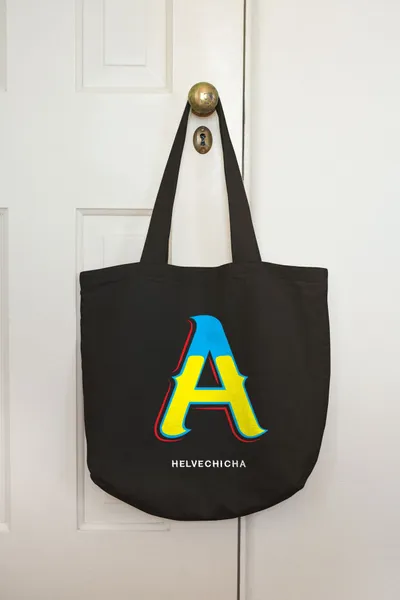 Letter patch on a black tote bag
