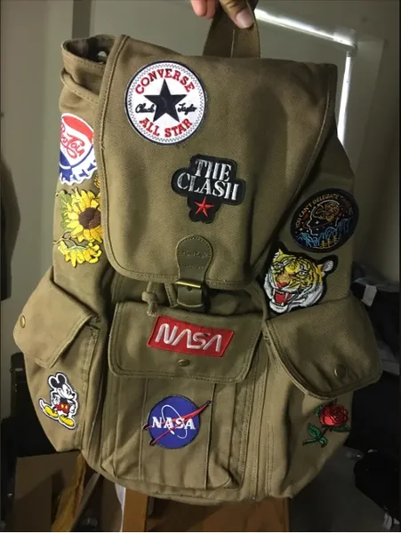 Assorted patches on a backpack