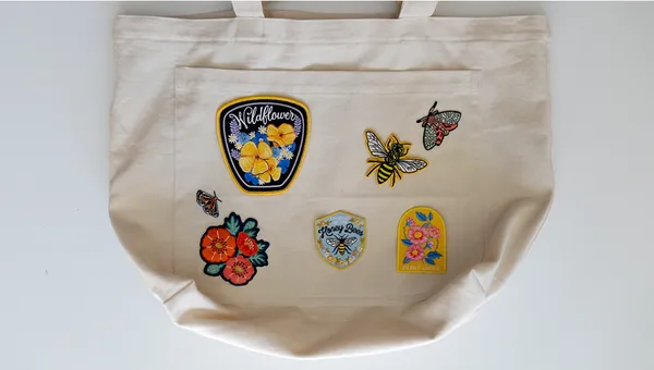 Nature patches on a canvas tote
